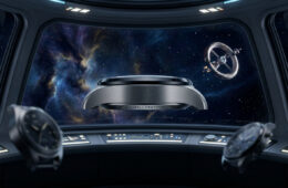 Trois montres IWC flottant dans le cockpit d'un vaisseau spatial avec une vue sur une nébuleuse et une station spatiale.